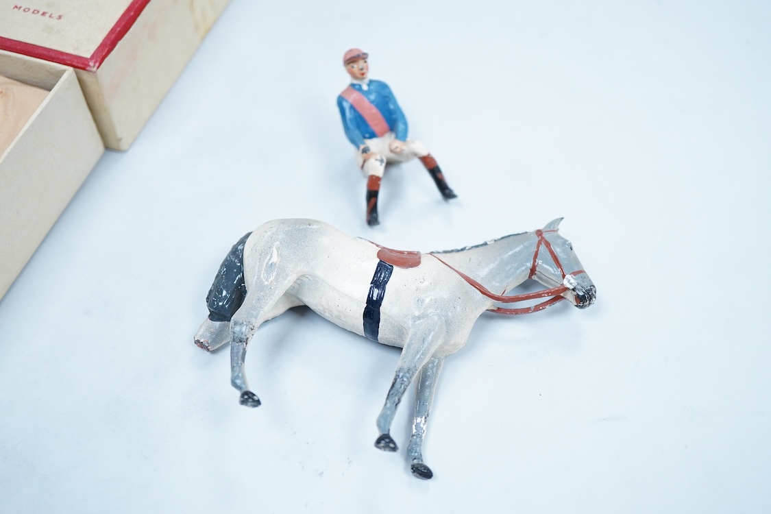 Two boxed Britains Racing Colours of Famous Owners series lead mounted figures; Lord Astor - rider in blue jersey with a pink sash on a grey horse (one leg broken and missing), and. the Duke of Norfolk - rider in blue je